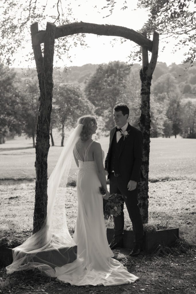 Wedding couple holding hands at sunset